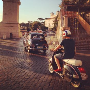 Old car and man on motorcycle in street - бесплатный image #331509
